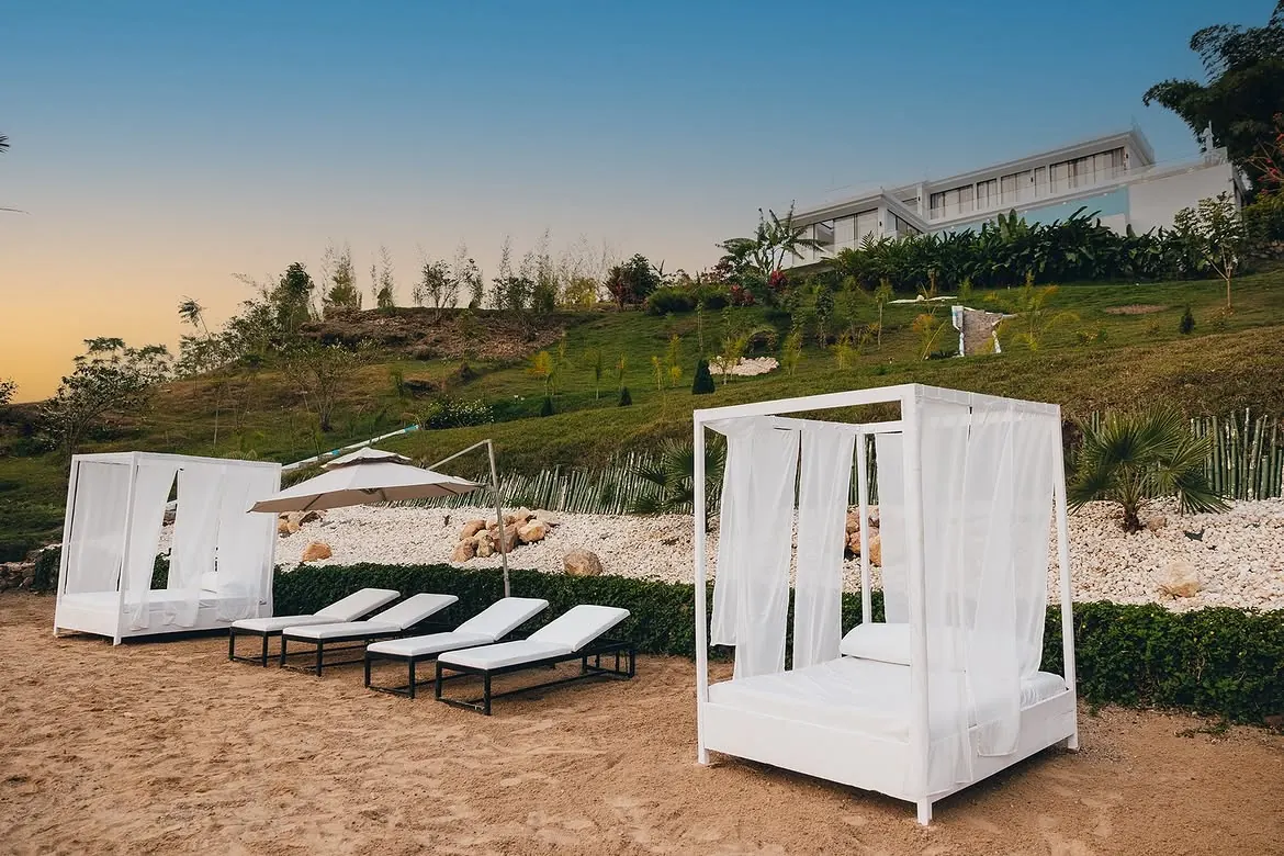 Canopy day beds on the private beach at B&P Ever Retreat Villa, Lake Kivu